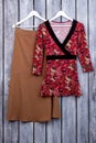 Red kimono on hanger.