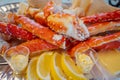 Red king crab legs with fresh lemon slices Royalty Free Stock Photo