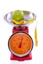 Red kitchen scale with an apple