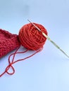 Red Knit Pattern with a Ball of Yarn