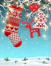 Red knitted christmas stocking with some scandinavian traditional decorations hanging on branches, decorative electric Royalty Free Stock Photo
