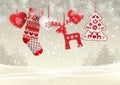 Red knitted christmas stocking with some scandinavian traditional decorations hanging on branches in front of simple Royalty Free Stock Photo