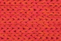 Red knitted fabric texture background macro closeup Royalty Free Stock Photo