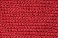 Red knitted fabric texture background. Top view. Copy, empty space for text Royalty Free Stock Photo