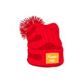 Red knitted hat with pompom