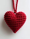 Red Knitted Heart Decoration Hanging on String over White Background Royalty Free Stock Photo