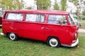Red Kombi van from the Volkswagen manufacturer completely restored during an exhibition in a park