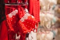 Red lace bra hanging on rack in underwear store. Toned with selective focus Royalty Free Stock Photo