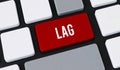 Red lag button on computer keyboard. Concept of slow internet connection, system delay and technical latency Royalty Free Stock Photo