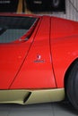 Red Lamborghini Miura SV behind with golden rims and bottom