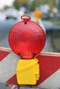 Red lamp to signal roadworks and road works in progress