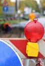 Red lamp to signal roadworks and road works