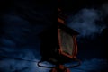 Red lamppost in a stormy dark night Royalty Free Stock Photo