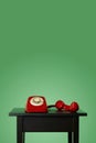 Red landline telephone off the hook on a table Royalty Free Stock Photo