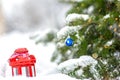 red lantern in the snow on Christmas Eve. Winter background. New Year's mood in preparation for the holidays Royalty Free Stock Photo