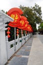 red lanterns along the road as a decoration make the road feel beautiful