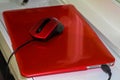 Red laptop with red mouse Royalty Free Stock Photo