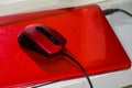 Red laptop with red mouse Royalty Free Stock Photo