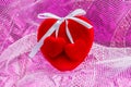 Red large heart with two small heart in pink background