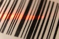Red laser barcode reader scanning a bar code. Macro bar code business Royalty Free Stock Photo