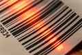 Red laser barcode reader scanning a bar code. Macro bar code business Royalty Free Stock Photo