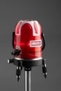 Red laser level tool on grey background Royalty Free Stock Photo