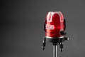 Red laser level tool on grey background Royalty Free Stock Photo