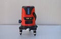 Red laser level tool on grey background Royalty Free Stock Photo