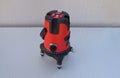Red laser level tool on grey background Royalty Free Stock Photo