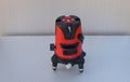 red laser level tool on grey background Royalty Free Stock Photo