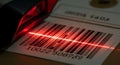 Red laser scanner reads a barcode on a product label for inventory and retail use Royalty Free Stock Photo