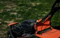 Red Lawn mower cutting grass Royalty Free Stock Photo