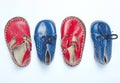 Red leather baby sandals and blue shoes