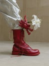 Crimson Leather Boot Adorned with Dragon and Lily. AI Generated Image. Royalty Free Stock Photo
