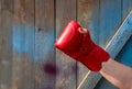 Red leather boxing glove on a woman`s hand Royalty Free Stock Photo
