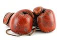 Red leather boxing gloves isolated on white background. Concept of boxing equipment, combat sports gear, training Royalty Free Stock Photo