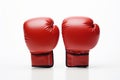 Red leather boxing gloves isolated on white background. Concept of boxing equipment, combat sports gear, training Royalty Free Stock Photo