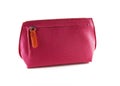 Red leather cosmetic bag on a zipper on a white background Royalty Free Stock Photo