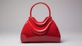 Red Leather Handbag With High Gloss Finish On Gray Background