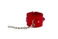 Red leather handcuffs in white background. Royalty Free Stock Photo