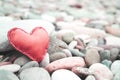 red leather heart on pebble stone still life for background Royalty Free Stock Photo