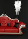 Red leather sofa with chandelier