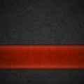 Red leather stripe on black leather background with copyspace -