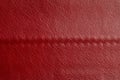 Red leather texture background. Luxury genuine textile surface material wallpaper with furniture backdrop. Close up of Royalty Free Stock Photo