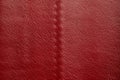 Red leather texture background. Luxury genuine textile surface material wallpaper with furniture backdrop. Close up of Royalty Free Stock Photo