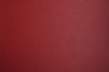 Red leatherette. Burgundy faux leather. Leather texture. Dark red background