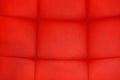 Red leather texture. Furniture upholstery with artificial rubber materials. Flat frame