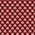 Red leather upholstery with sewin rivets. Luxury background Royalty Free Stock Photo