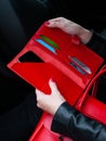Red leather wallet in hand Royalty Free Stock Photo