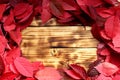 Texture red autumn leaves are scattered around the table Royalty Free Stock Photo